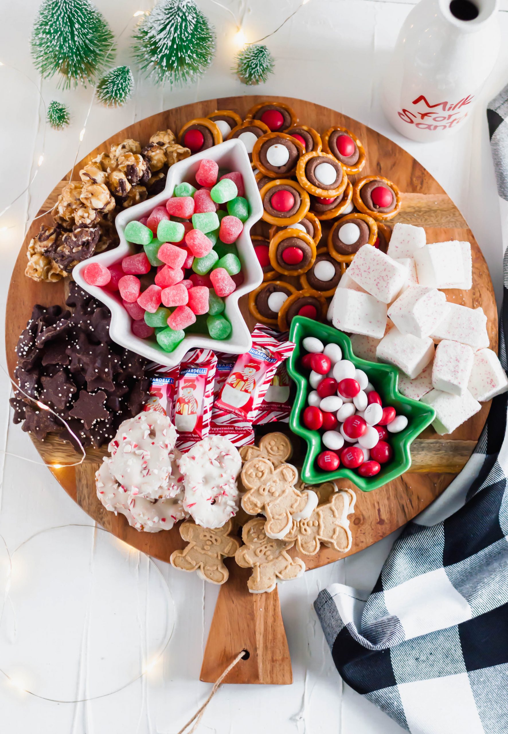 This Easy Christmas Dessert Board will be the talk of your Christmas party. A homemade treat or two filled in with fun, festive cookies and candies.